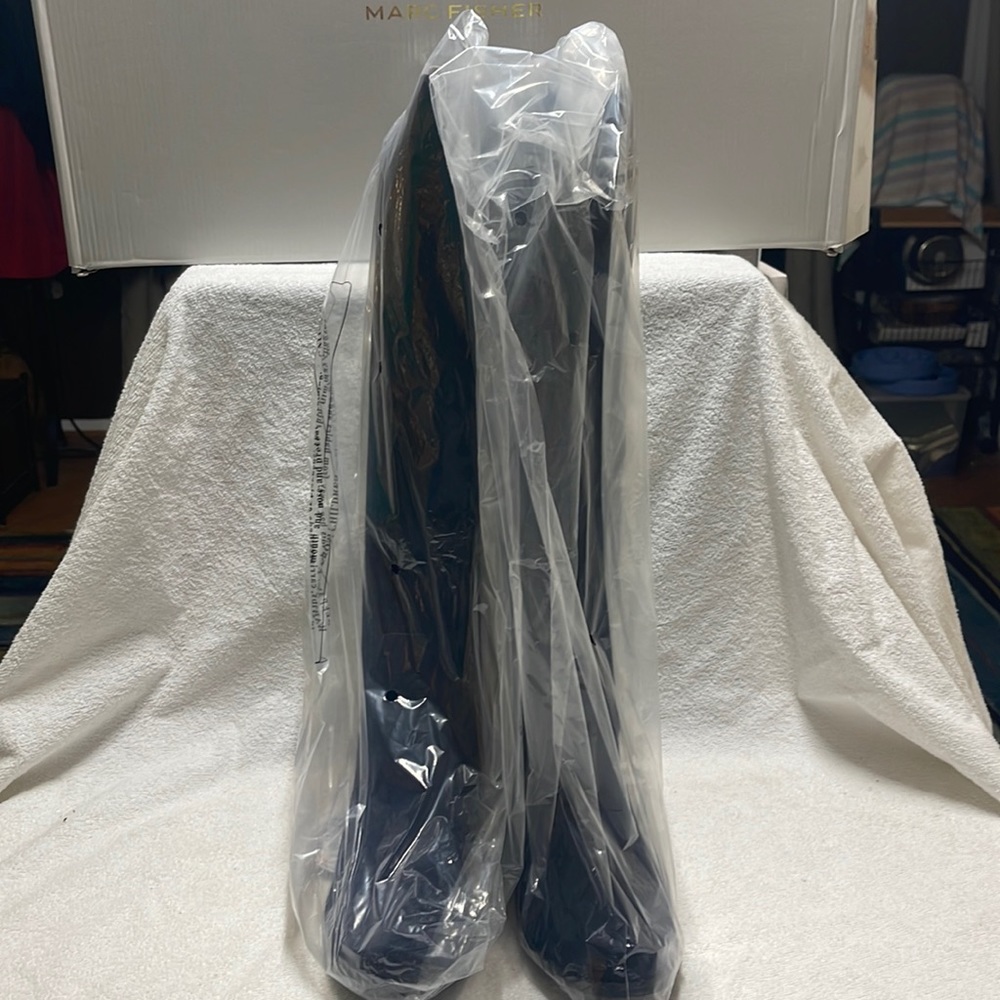 Tall knee high boots.Smoke free home. No tears.NIB